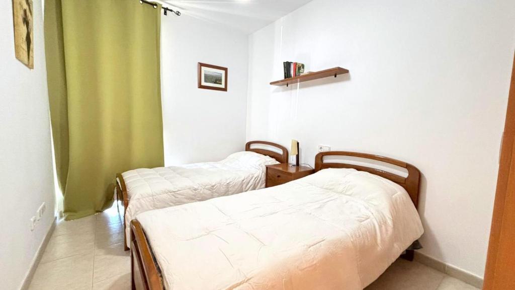 A bed or beds in a room at Puigmal