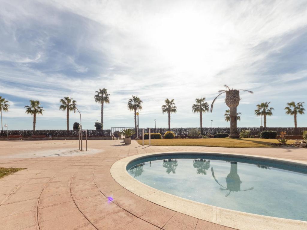 The swimming pool at or close to Apartment Els Pins Eduardo-7 by Interhome