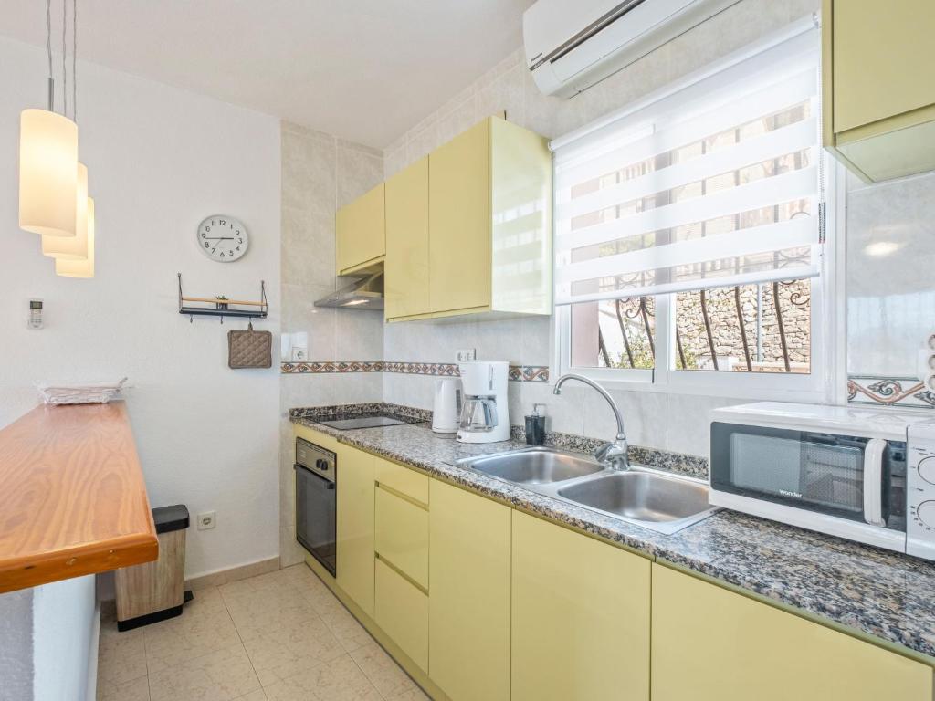 Kuchyň nebo kuchyňský kout v ubytování Holiday Home Las Mimosas by Interhome