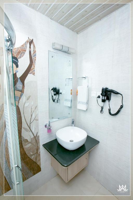 Koupelna v ubytování Hotel Maya Boutique & Apartment