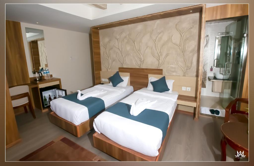 Postel nebo postele na pokoji v ubytování Hotel Maya Boutique & Apartment