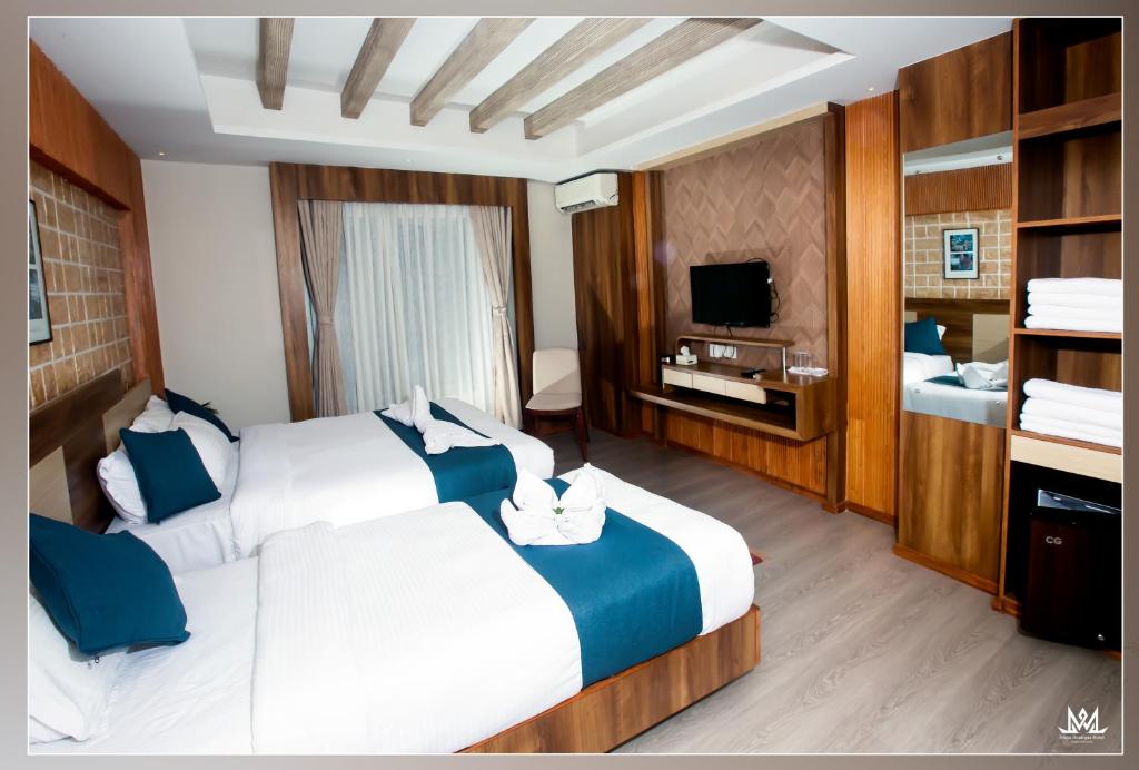 Postel nebo postele na pokoji v ubytování Hotel Maya Boutique & Apartment