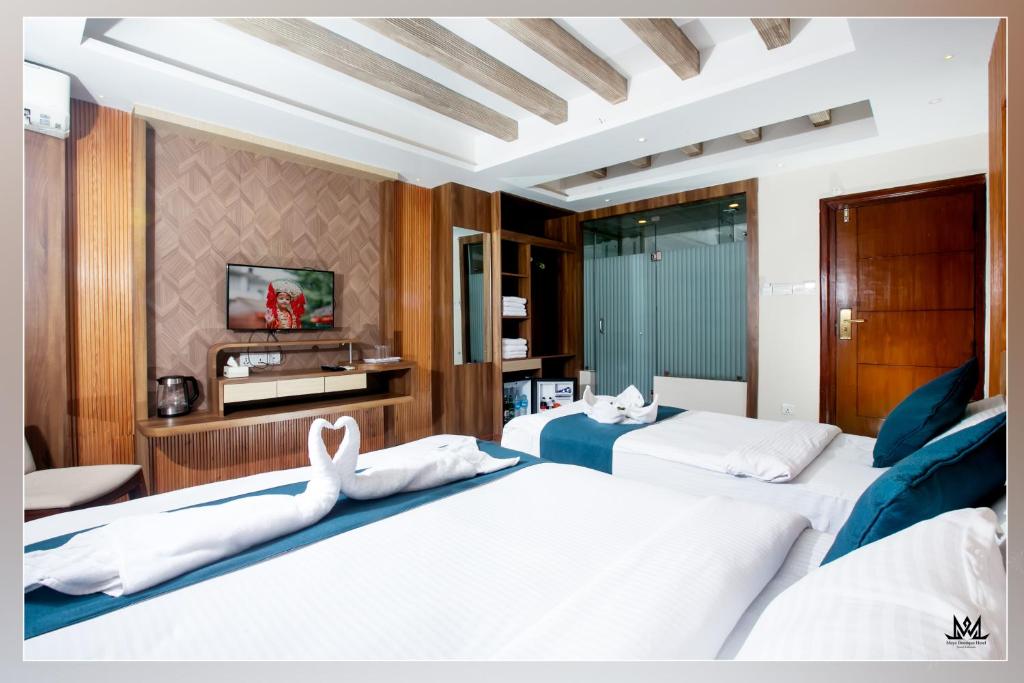 Postel nebo postele na pokoji v ubytování Hotel Maya Boutique & Apartment