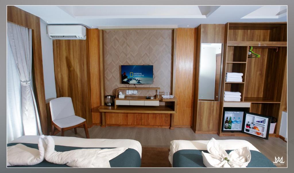 TV a/nebo společenská místnost v ubytování Hotel Maya Boutique & Apartment