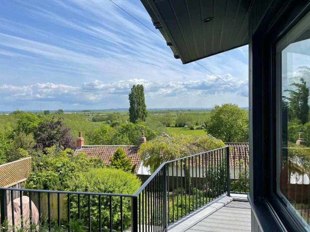 a view from the balcony of a house at Stunning Hillside House in Langport