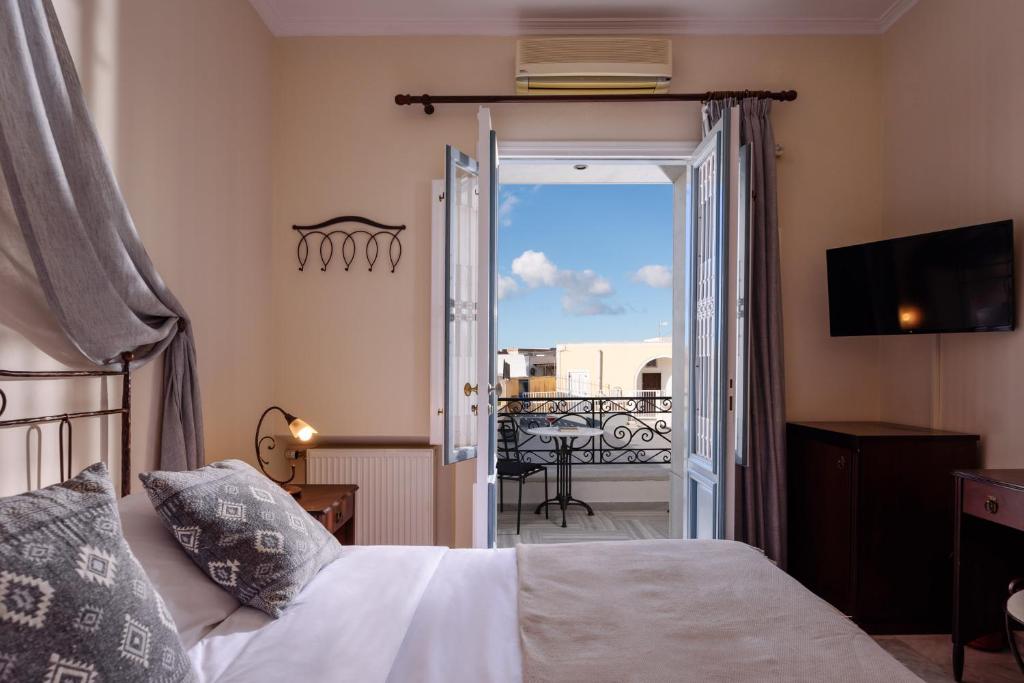 Letto o letti in una camera di Ikio Concept Santorini
