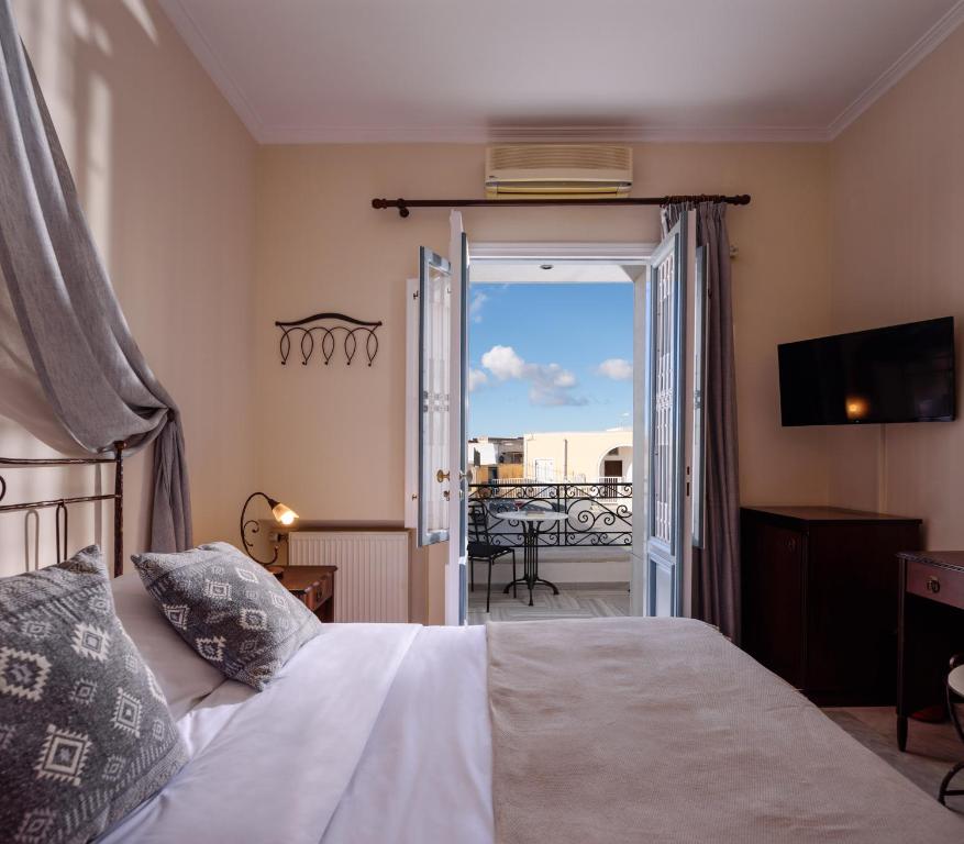 Letto o letti in una camera di Ikio Concept Santorini