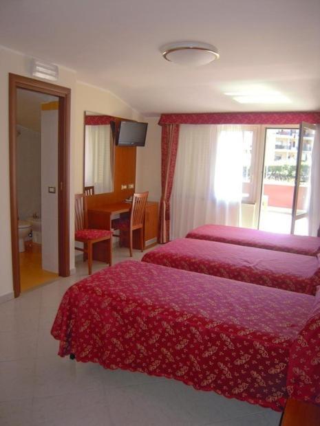 Postel nebo postele na pokoji v ubytování Hotel Vitti
