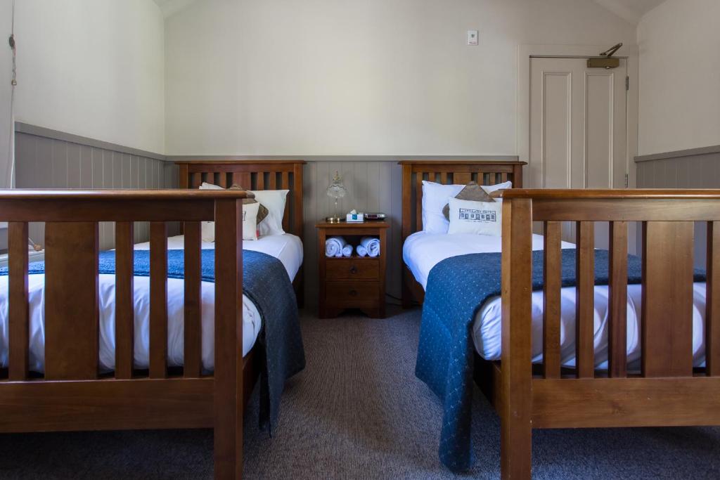 Postel nebo postele na pokoji v ubytování Cardrona Hotel