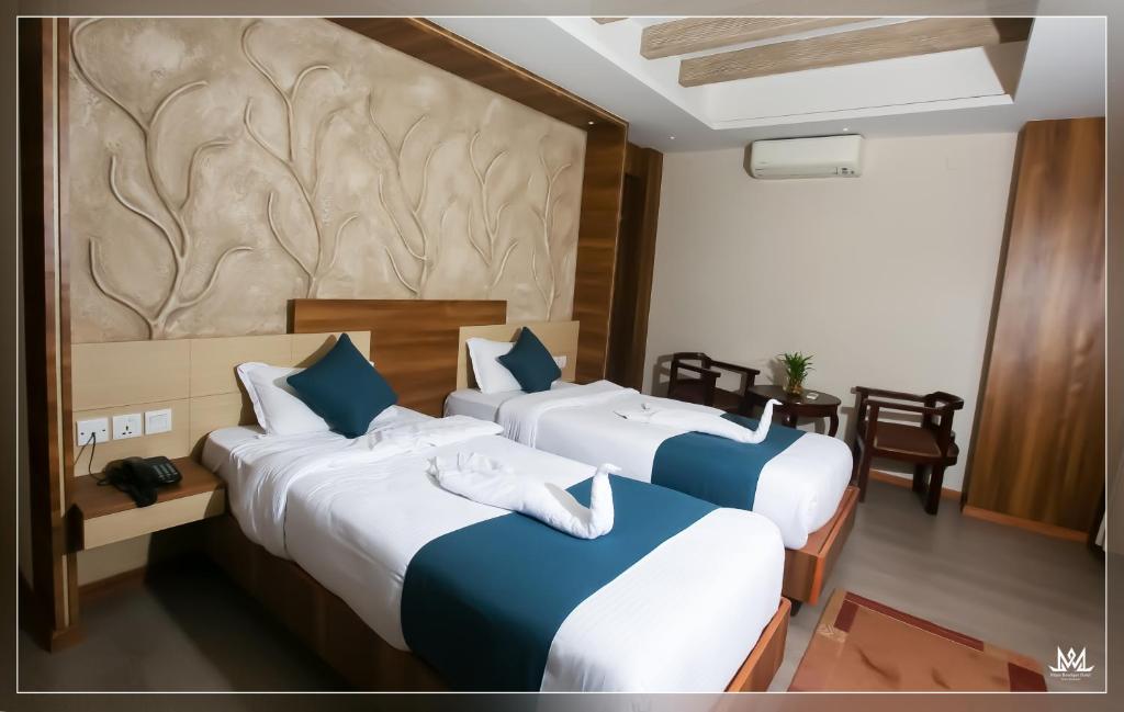 Postel nebo postele na pokoji v ubytování Hotel Maya Boutique & Apartment