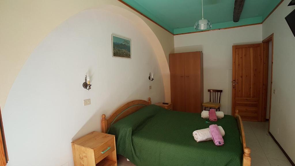 Postel nebo postele na pokoji v ubytování Casa Vittorio B&b