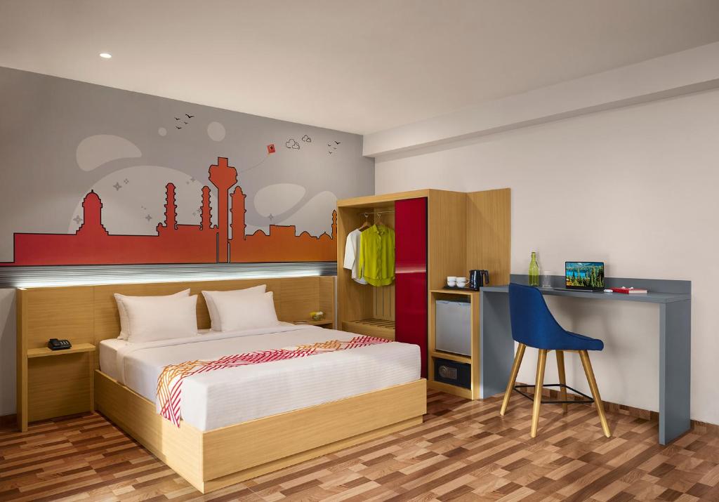 Postel nebo postele na pokoji v ubytování Ginger Ahmedabad Changodar
