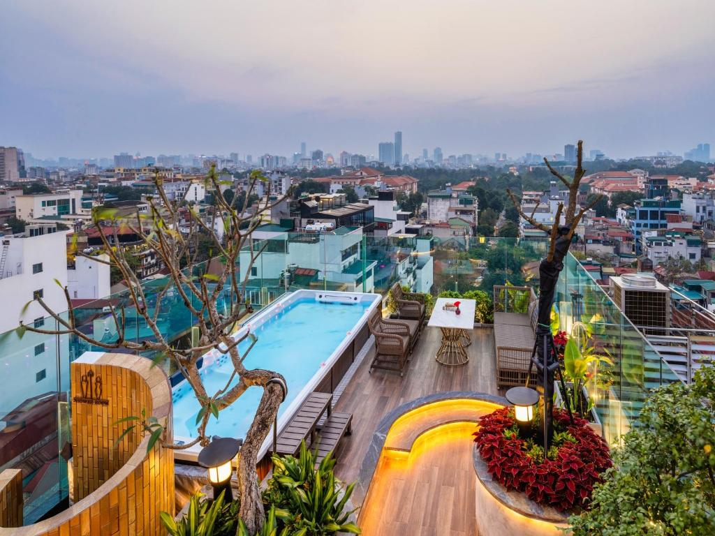 a view of a swimming pool on top of a building at Peridot Gallery Classic Hotel in Hanoi