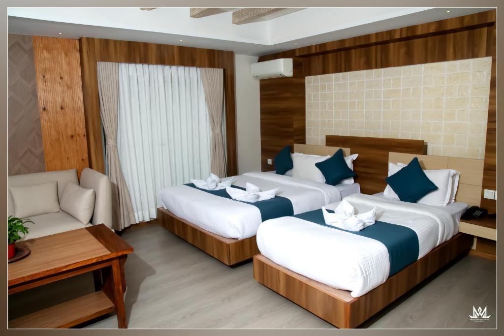 Postel nebo postele na pokoji v ubytování Hotel Maya Boutique & Apartment