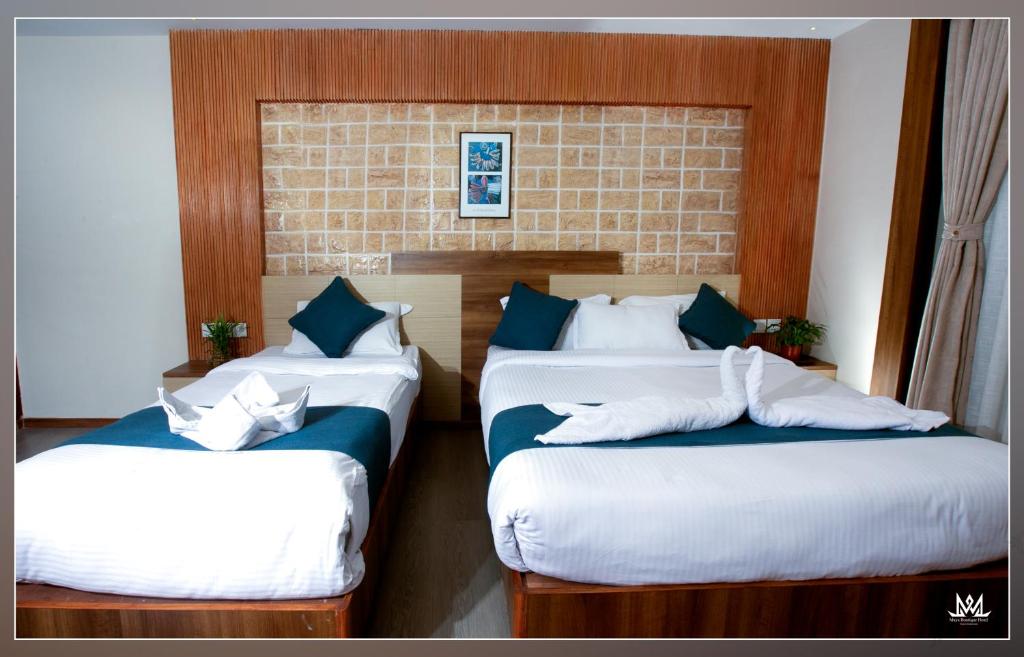 Postel nebo postele na pokoji v ubytování Hotel Maya Boutique & Apartment