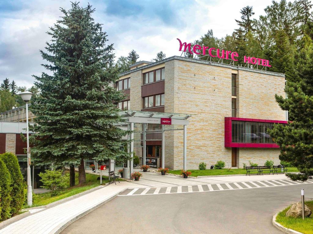 a building with a sign on top of it at Mercure Karpacz Skalny in Karpacz