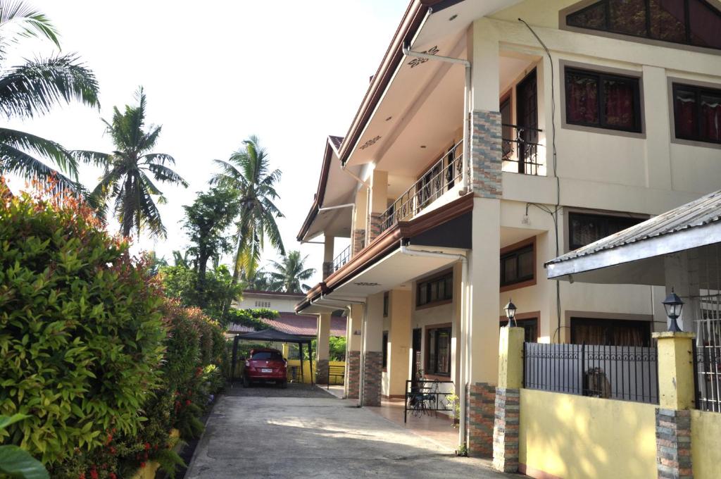 a street in front of a building at Pal-Watson Apartments in Mactan