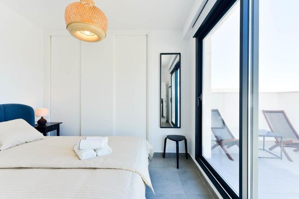 Postel nebo postele na pokoji v ubytování Balcon del Mar
