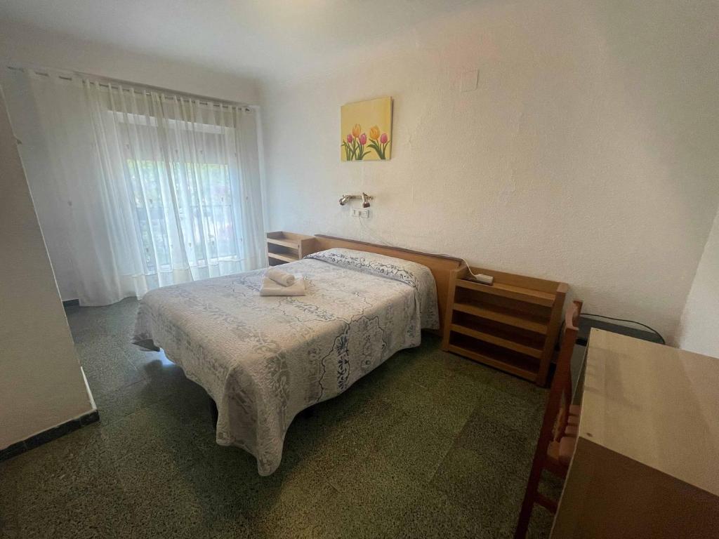 Postel nebo postele na pokoji v ubytování Hostal Cumbre