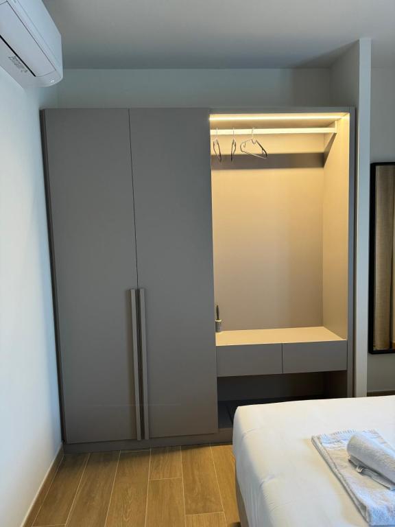 a bedroom with a closet and a bed in it at Résidence CATALINA in Saint-Florent