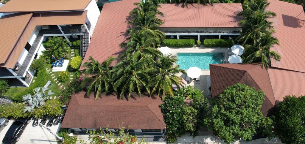 an aerial view of a house with a swimming pool at Lotus Bleu Resort & Restaurant in Rawai Beach