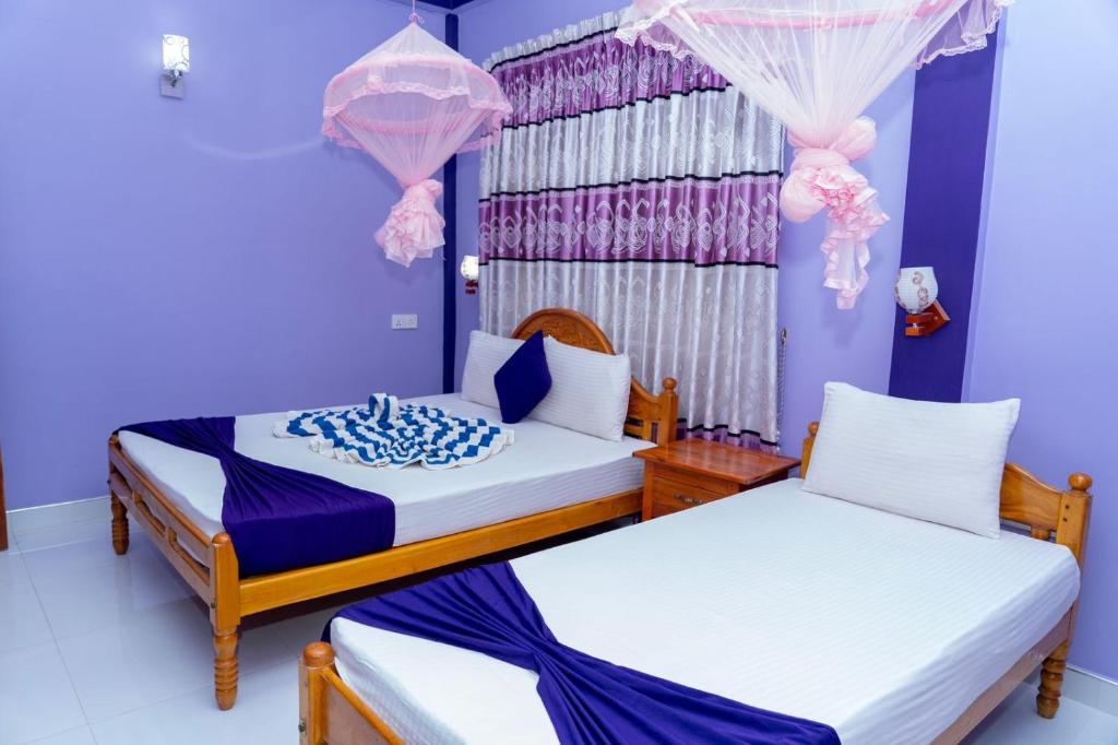 Postel nebo postele na pokoji v ubytování SNP Star Guest House