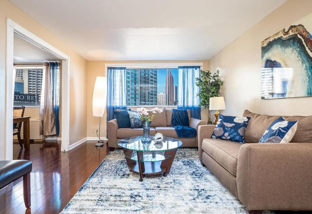 a living room with a couch and a table at ATL Downtown City View Onsite Parking LM802 in Atlanta