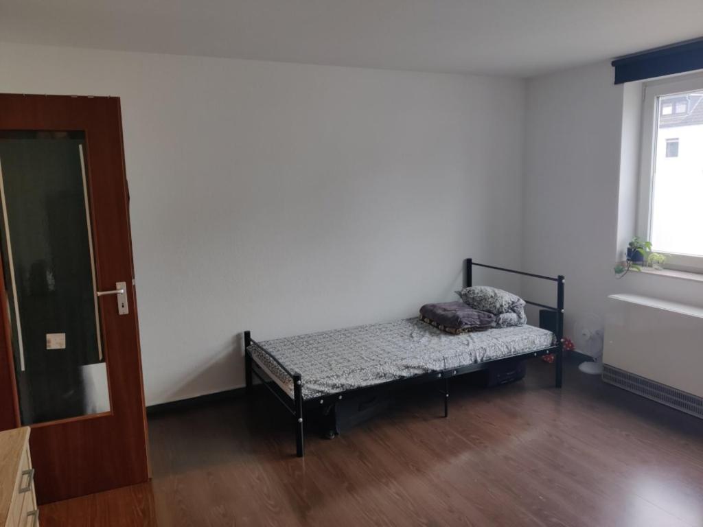 Ein Bett oder Betten in einem Zimmer der Unterkunft Apartment in der Nähe der Universität