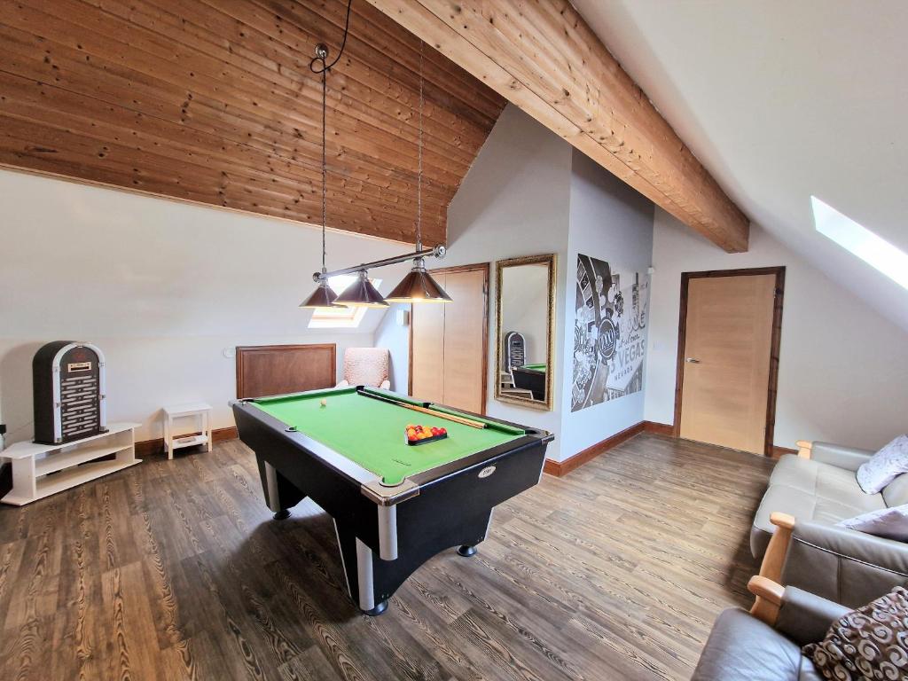 a living room with a pool table in it at Lbtie Lodge with Two Private Hot Tubs - Fife - Loch Leven - Lomond Hills in Kelty