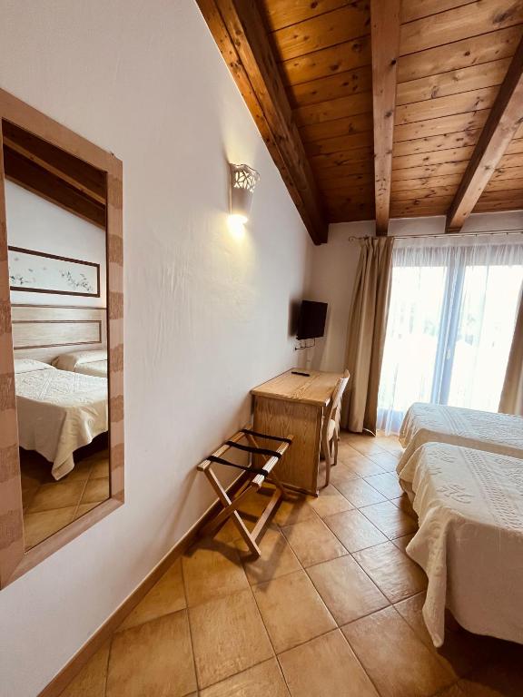 Postel nebo postele na pokoji v ubytování Hotel La Borgata