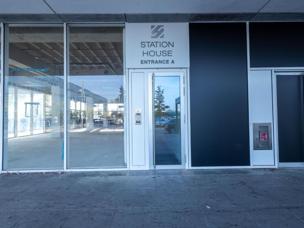 an entrance to a building with a sign on the door at Stunning City View Apartments in Milton Keynes Central Location Free Parking in Milton Keynes