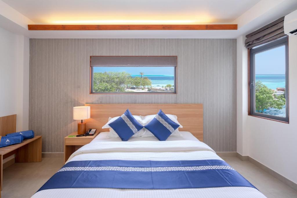 Postel nebo postele na pokoji v ubytování Ayala Oceanview Maldives