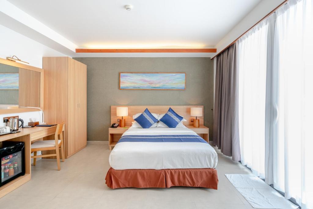 Postel nebo postele na pokoji v ubytování Ayala Oceanview Maldives