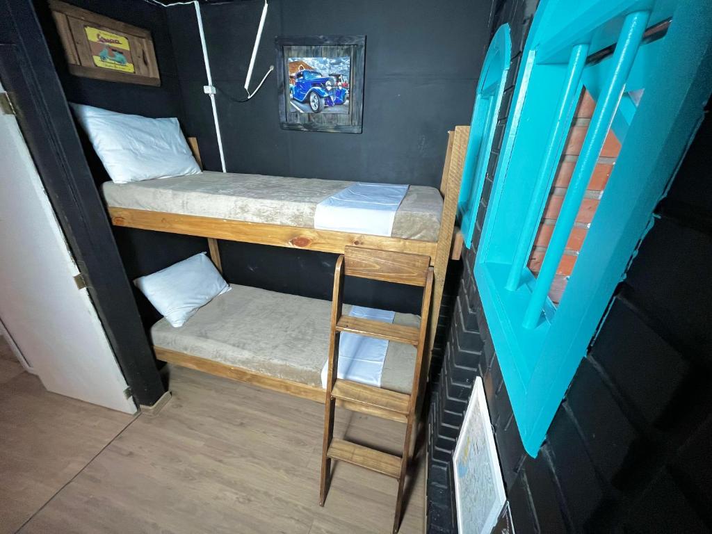 Postel nebo postele na pokoji v ubytování Casa do Rogério Hostel