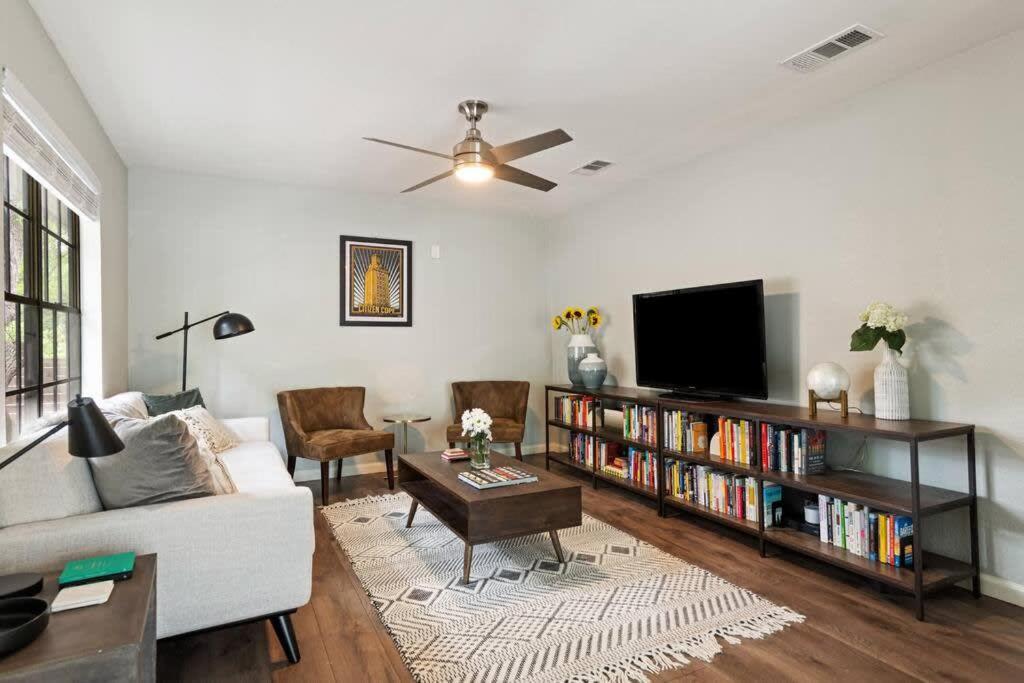 a living room with a couch and a tv at Charming South Austin 2 Bedroom Home in Austin