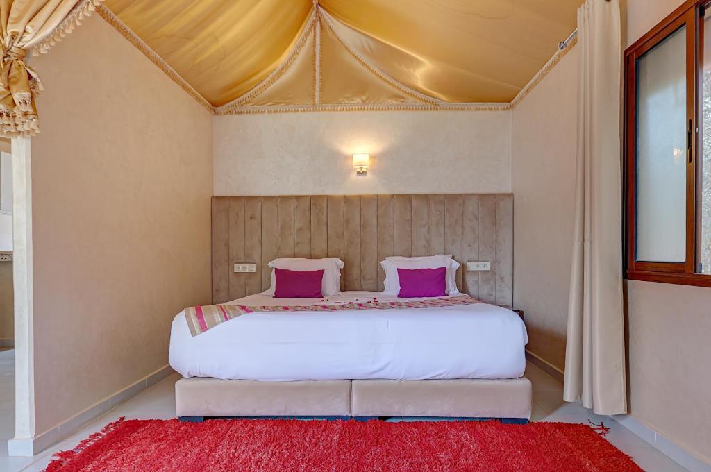 Postel nebo postele na pokoji v ubytování Ferme Sidi Safou & Spa