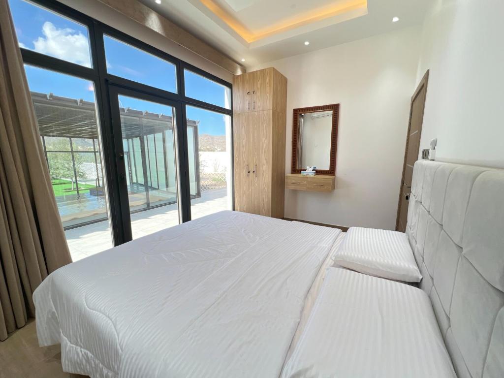 Postel nebo postele na pokoji v ubytování ALSALAM Hostels نزل السلام