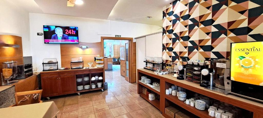 Kuchyň nebo kuchyňský kout v ubytování Hotel Vilagarcia