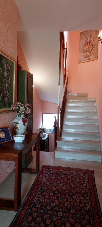 a living room with a staircase and a rug at Apartments Duda in Pula