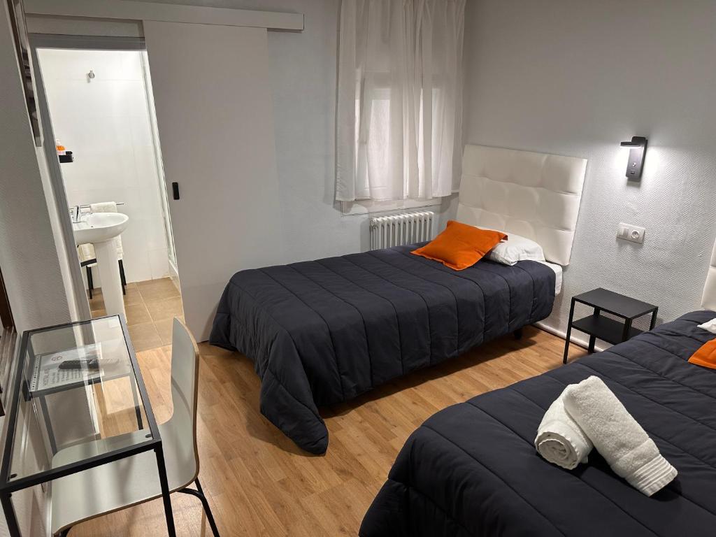 Posteľ alebo postele v izbe v ubytovaní Hostal ARS