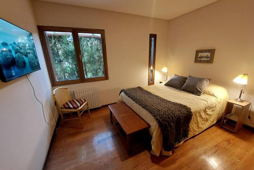 מיטה או מיטות בחדר ב-Monique's luxury, chacras de Coria