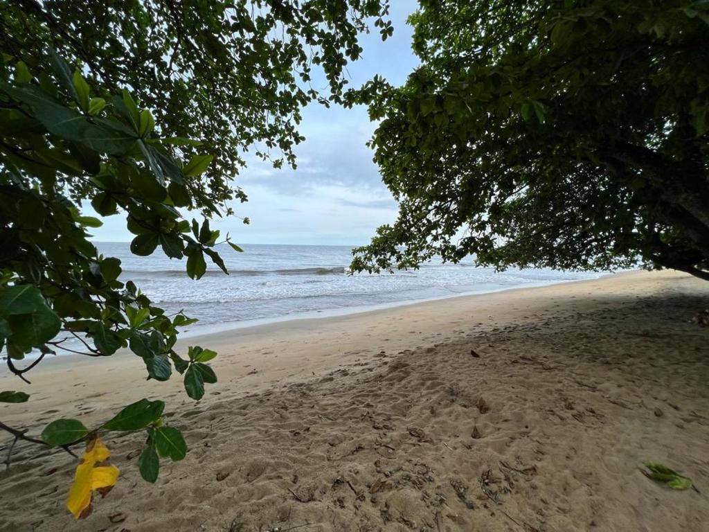 a beach with a view of the ocean at Akiba Guests Houses in Kribi
