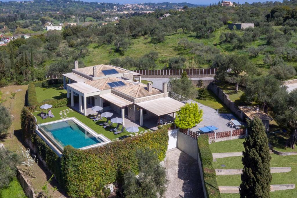 an aerial view of a house with a swimming pool at Luxury Villa Helanes in Corfu