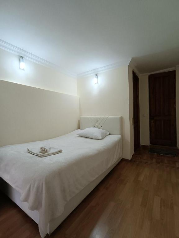 Postel nebo postele na pokoji v ubytování Guest House Lili