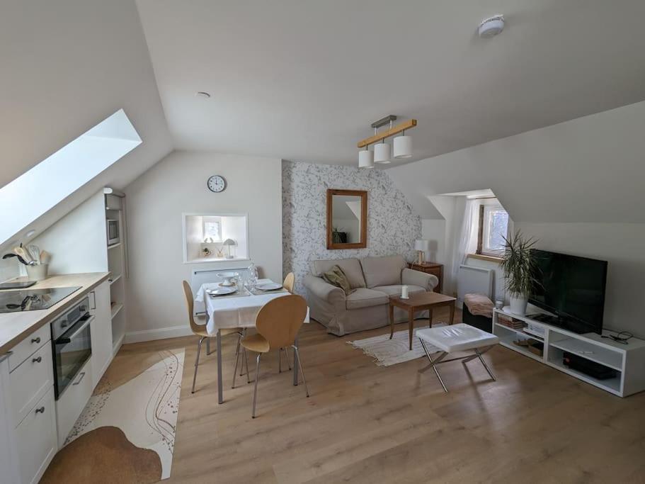 a large living room with a couch and a table at Le cocon, T2, hypercentre in Cherbourg en Cotentin