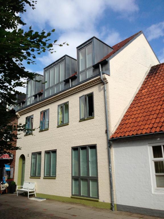 a building with windows on the top of it at Casa Cinzia Lucia in Eckernförde