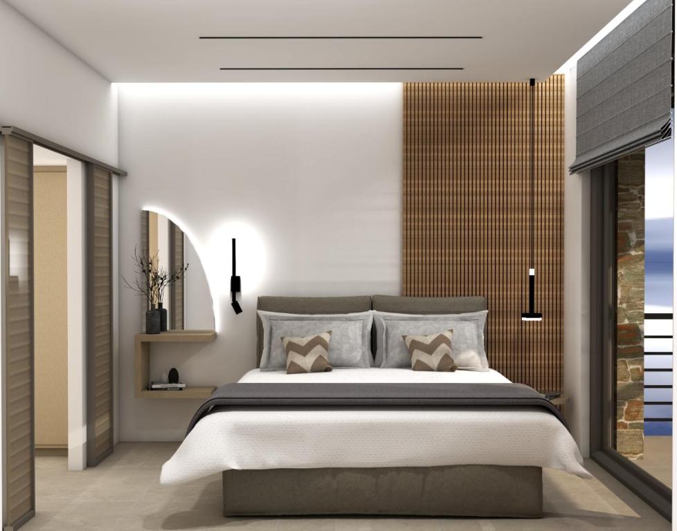 Posteľ alebo postele v izbe v ubytovaní Thea Suites