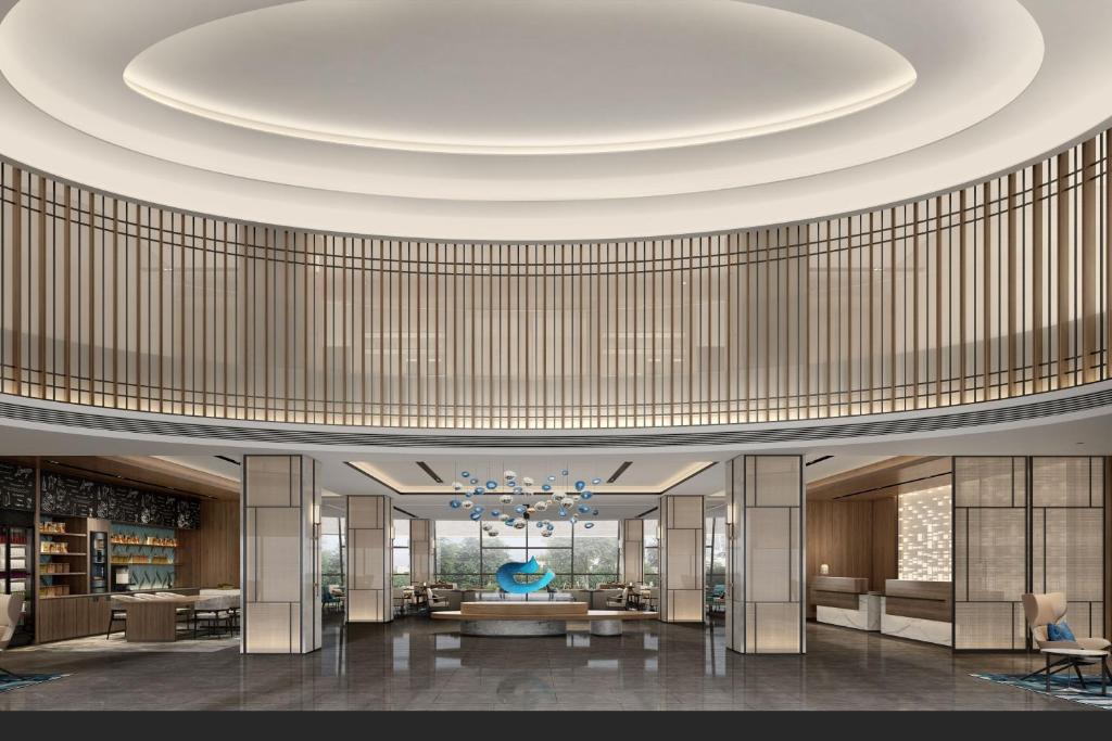 a rendering of a lobby with a circular ceiling at Fairfield by Marriott Guangzhou Konggang in Guangzhou