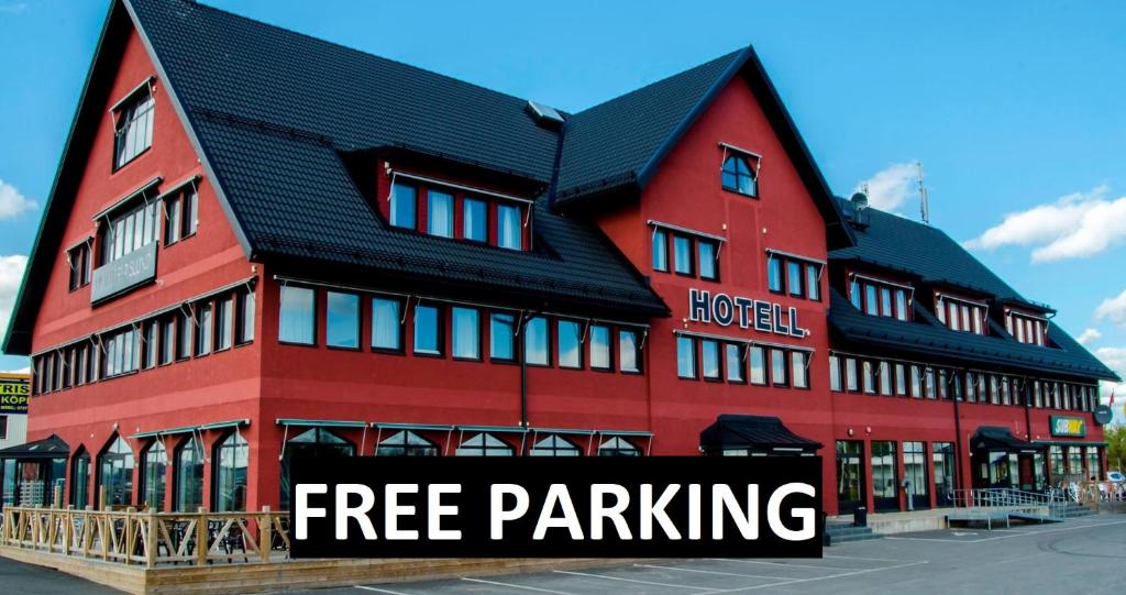 a large red building with the words free parking at Hotell Fyrislund in Uppsala