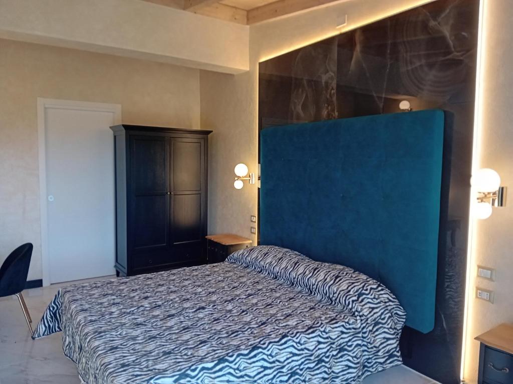 Postel nebo postele na pokoji v ubytování angolo di paradiso